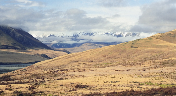 snow mountain field clouds