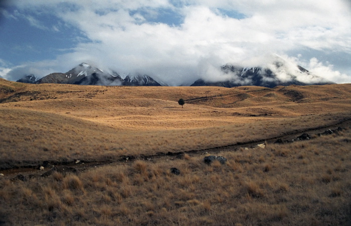 snow mountain field clouds