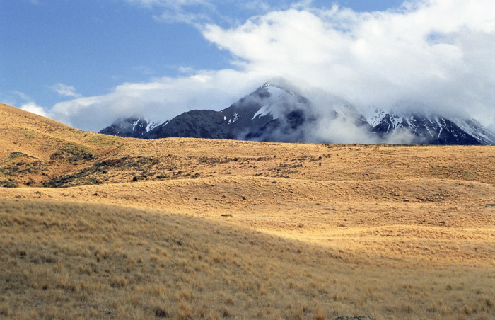 snow mountain field clouds