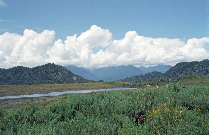 river mountain field clouds