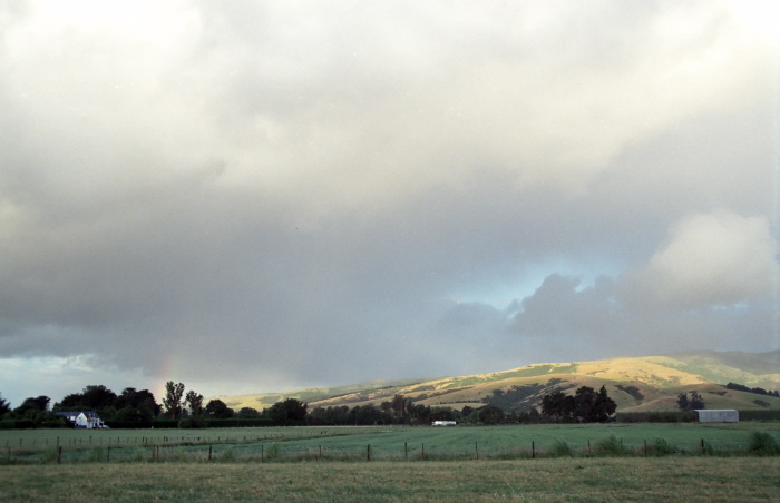 field clouds building